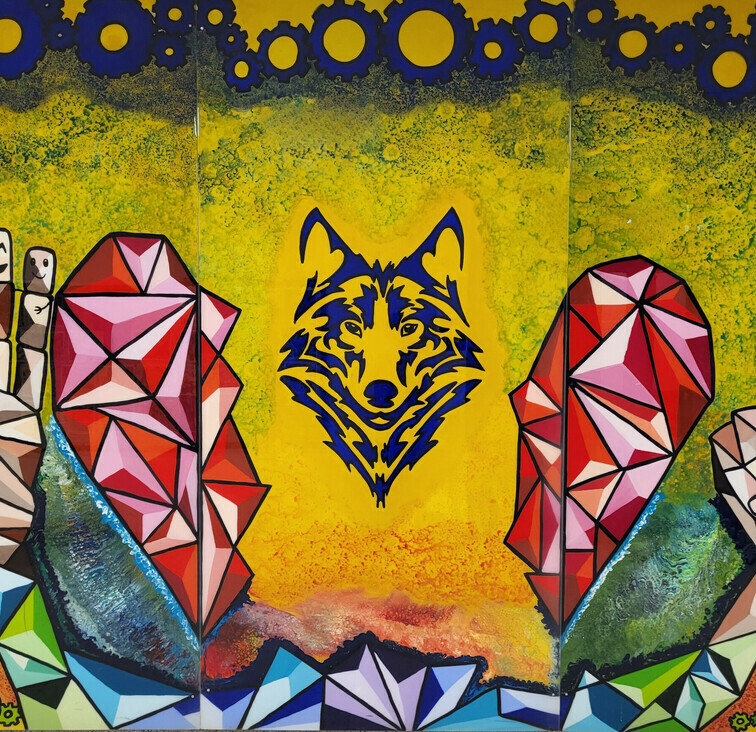 mural showing the BPS wolf logo, a heart and two hands